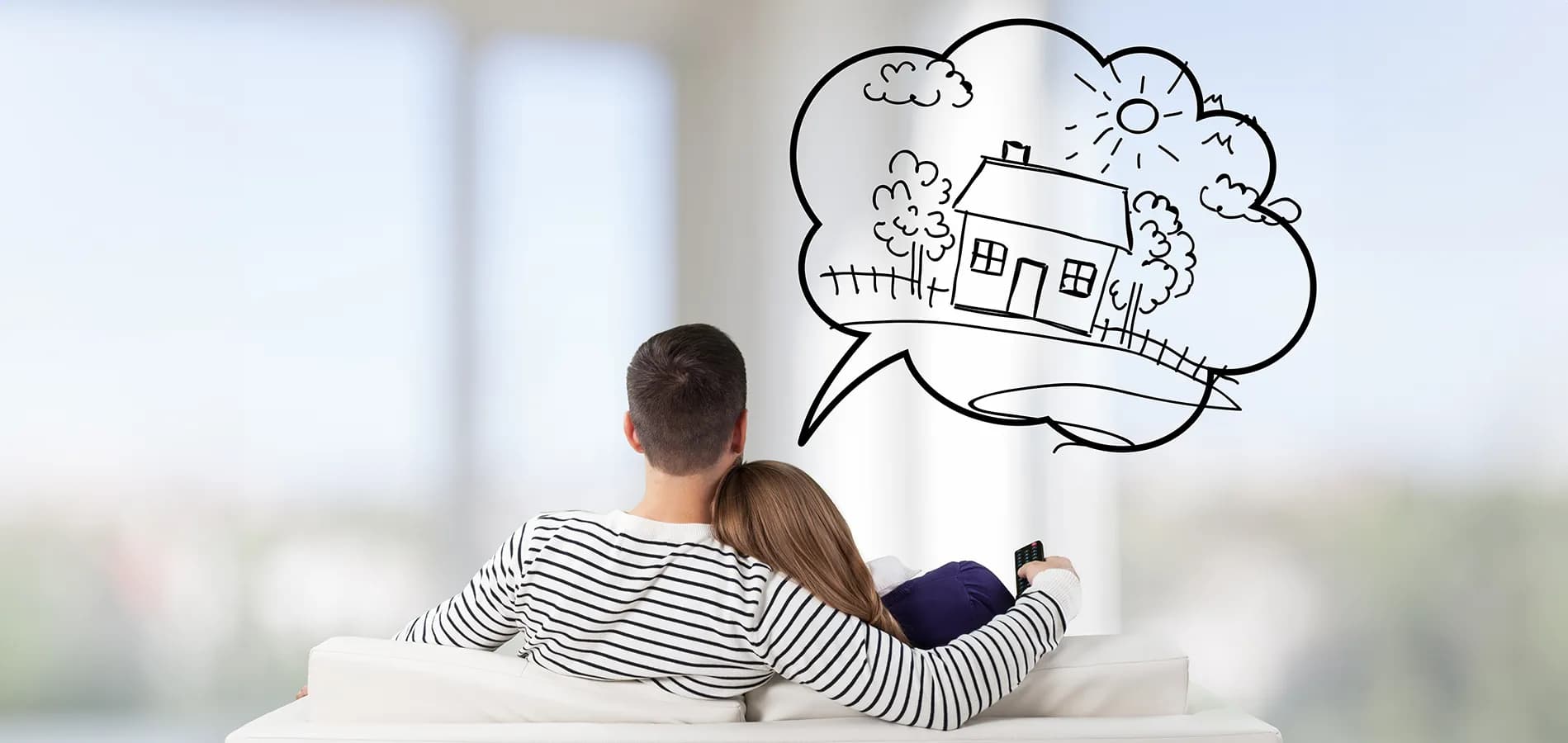 young-couple-sitting-on-sofa-778754047